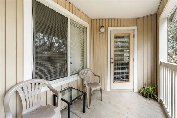 a view of a room with porch and wooden floor