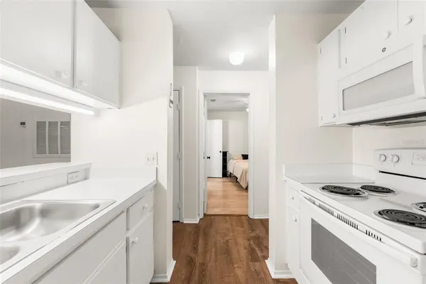 a kitchen with a stove and a sink