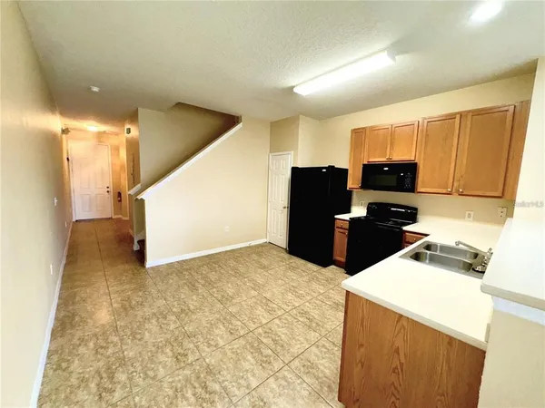 a view of a kitchen with a sink