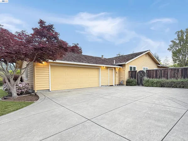 a view of backyard of house with garage