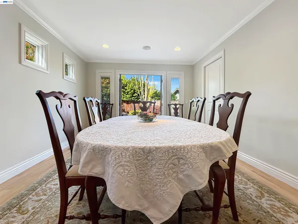 a view of a dining room with furniture window and outside view