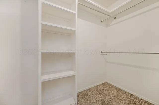 a view of an empty walk in closet