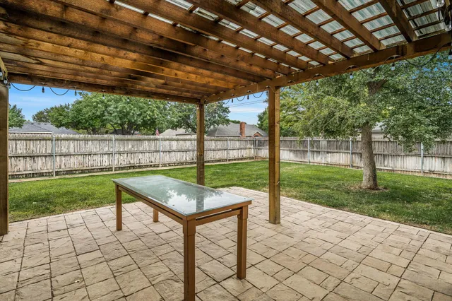 a view of a backyard with wooden floor and backyard