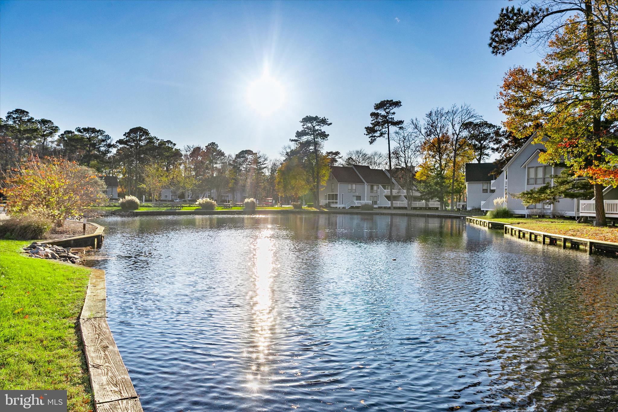 39655 Tie Breaker Court, Unit 4801 Bethany Beach, DE 19930 - Photo 11 of 58 a view of a lake with houses