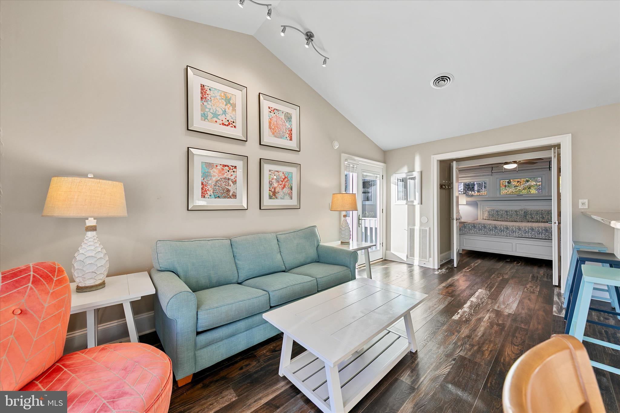 39655 Tie Breaker Court, Unit 4801 Bethany Beach, DE 19930 - Photo 13 of 58 a living room with furniture and a window