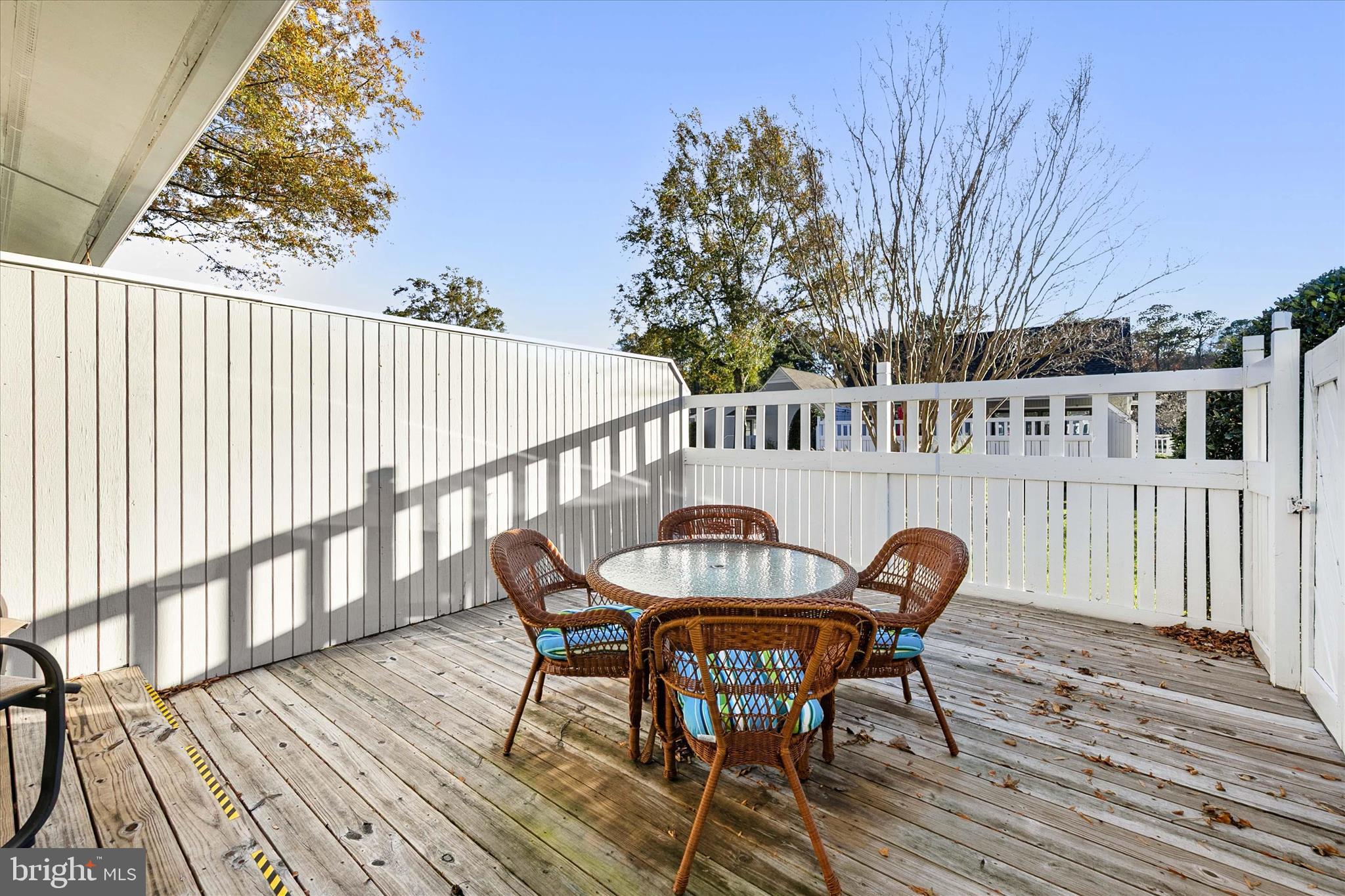 39655 Tie Breaker Court, Unit 4801 Bethany Beach, DE 19930 - Photo 34 of 58 a view of a chairs and table on the wooden floor