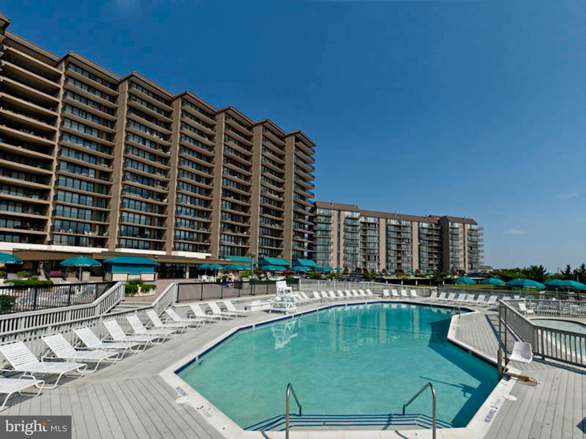 39655 Tie Breaker Court, Unit 4801 Bethany Beach, DE 19930 - Photo 40 of 58 a view of swimming pool with outdoor seating and city view