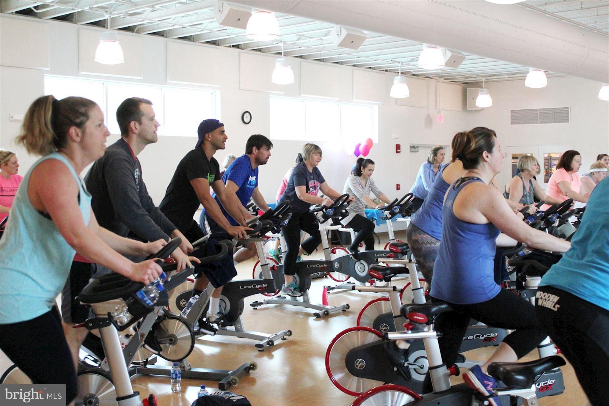 39655 Tie Breaker Court, Unit 4801 Bethany Beach, DE 19930 - Photo 44 of 58 a group of people sitting in a room