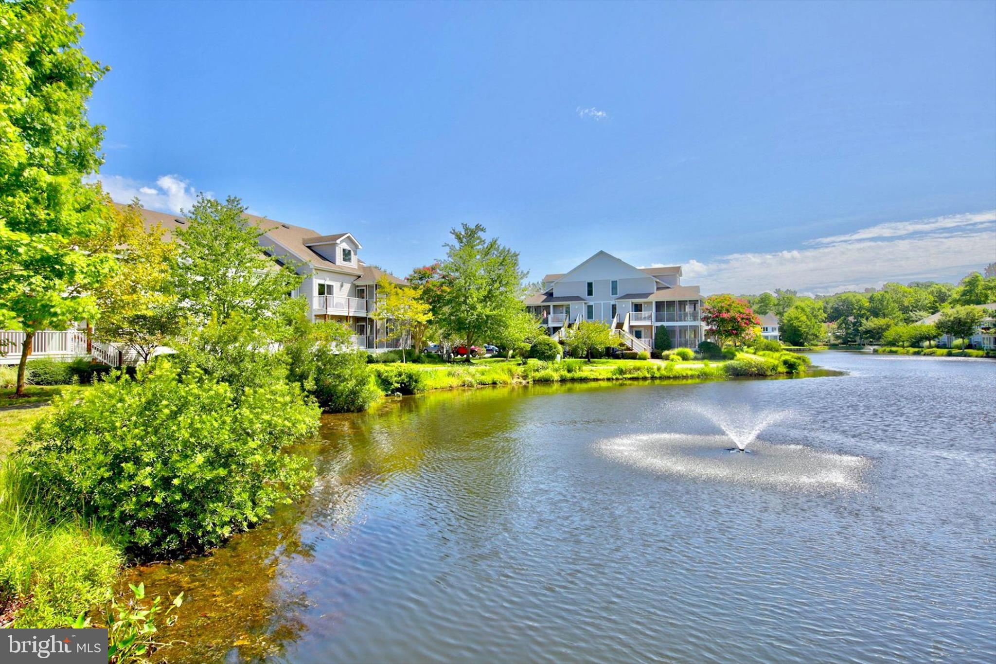 39655 Tie Breaker Court, Unit 4801 Bethany Beach, DE 19930 - Photo 45 of 58 a view of a lake with a houses