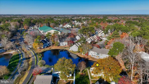 an aerial view of house with yard swimming pool and outdoor seating