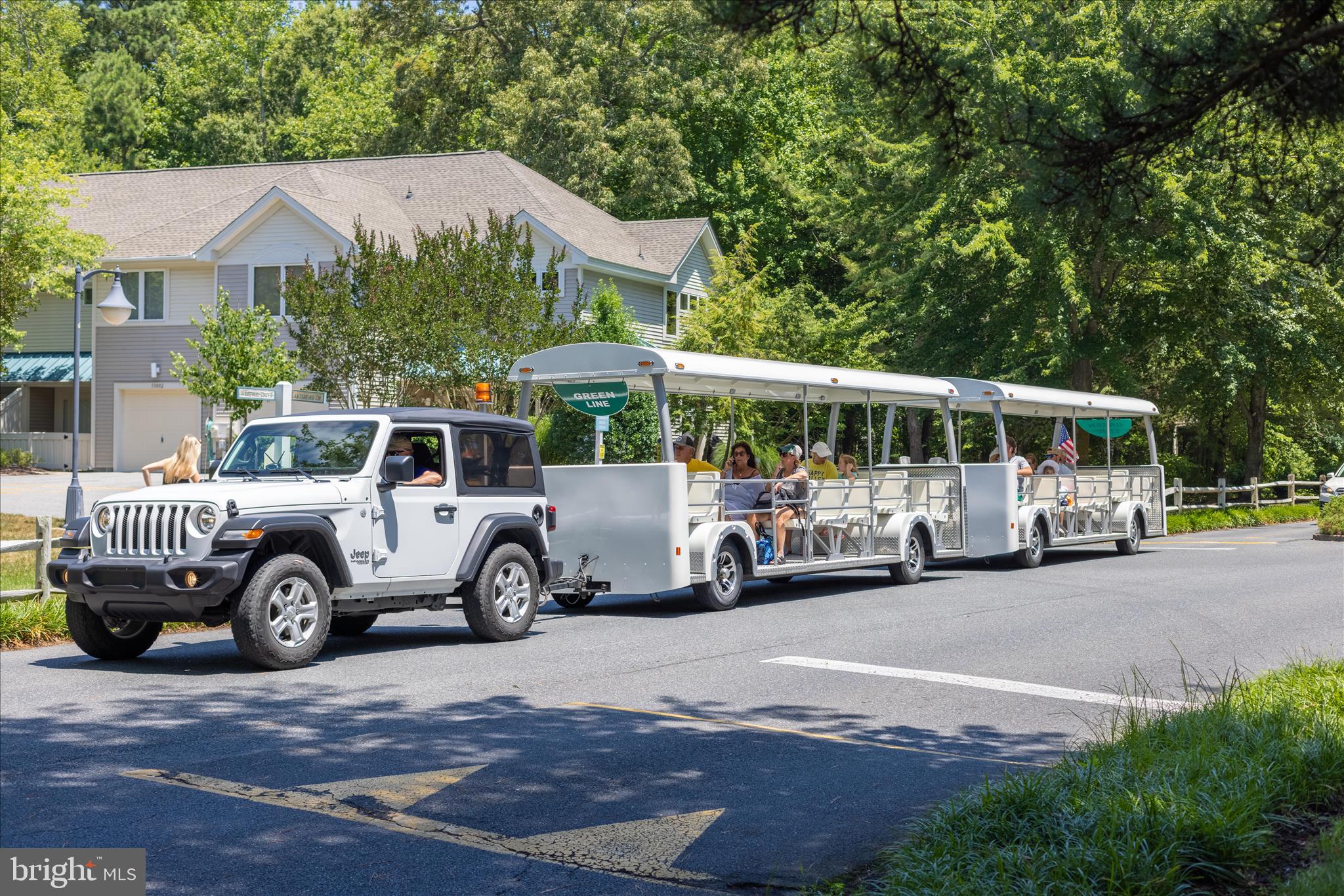 39655 Tie Breaker Court, Unit 4801 Bethany Beach, DE 19930 - Photo 52 of 58 a view of a cars parked in front of a house