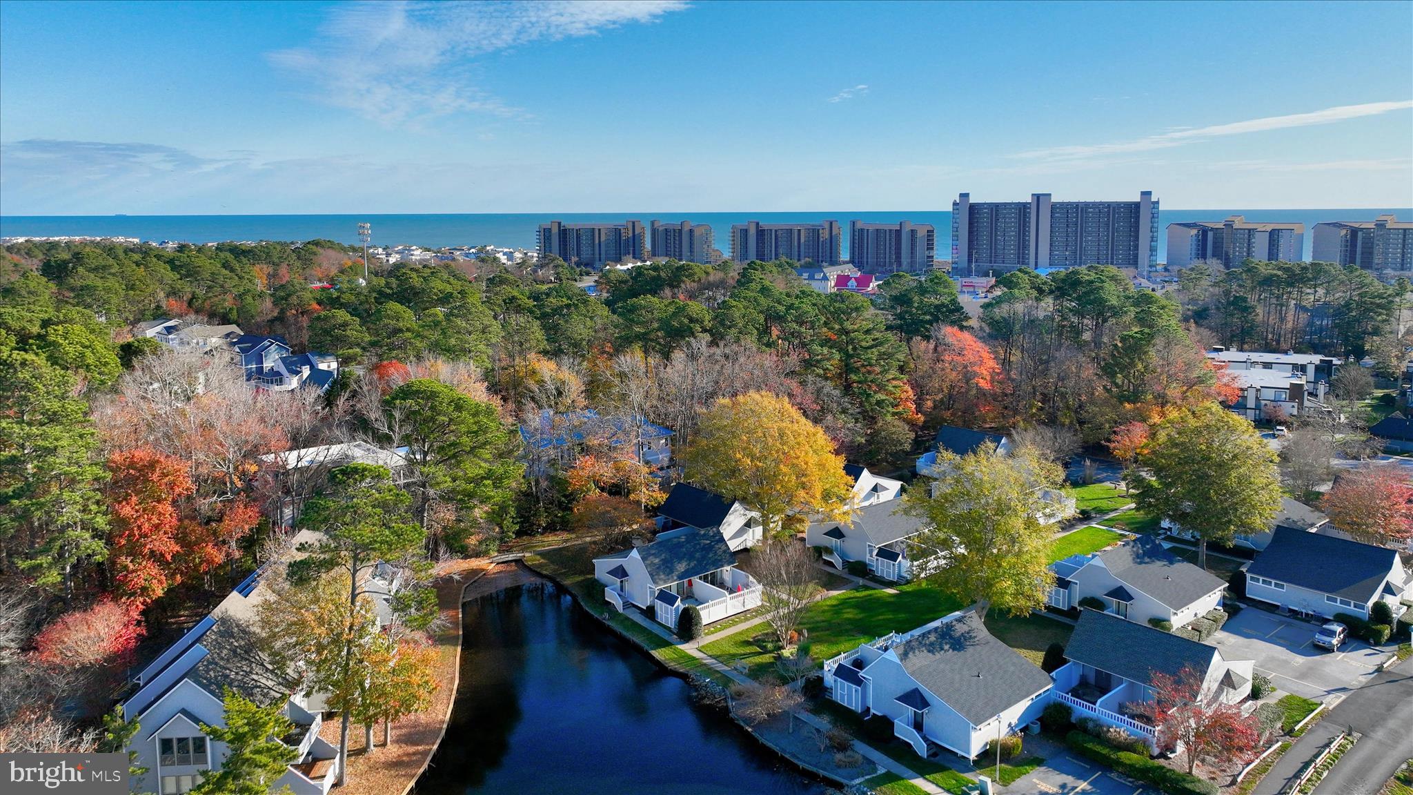 39655 Tie Breaker Court, Unit 4801 Bethany Beach, DE 19930 - Photo 6 of 58 an aerial view of a house with a yard and lake view