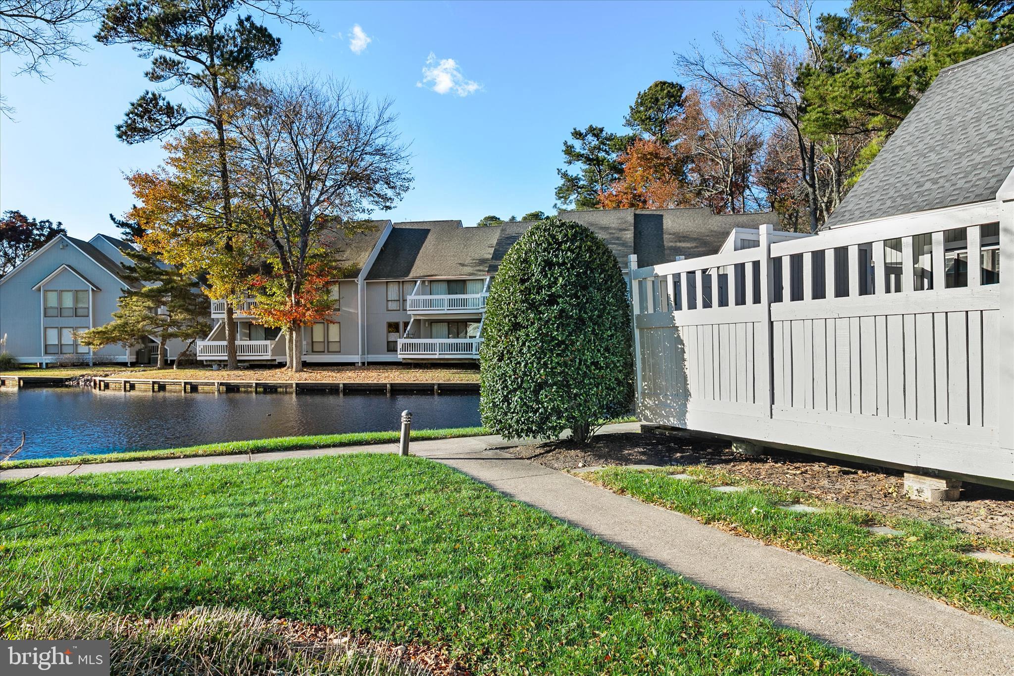 39655 Tie Breaker Court, Unit 4801 Bethany Beach, DE 19930 - Photo 10 of 58 a view of a house with a yard and sitting area