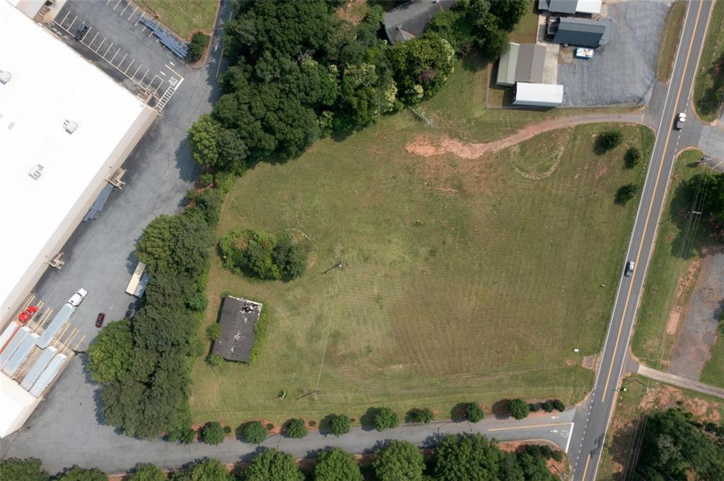 222 Brown Road Anderson, SC 29621 - Photo 1 of 12 A spacious, verdant lot awaits your vision, bordered by paved roads and established trees.