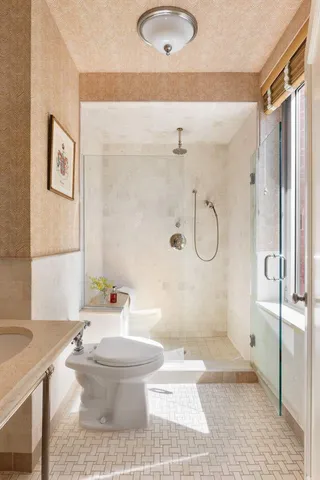 a bedroom with bed and a window