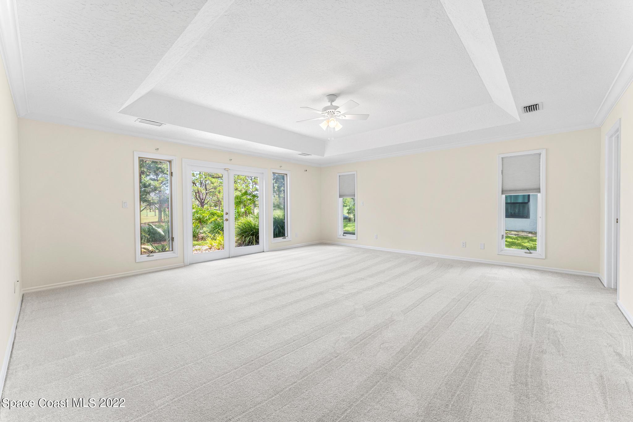 750 Kerry Downs Circle Melbourne, FL 32940 - Photo 12 of 34 a view of an empty room with a window