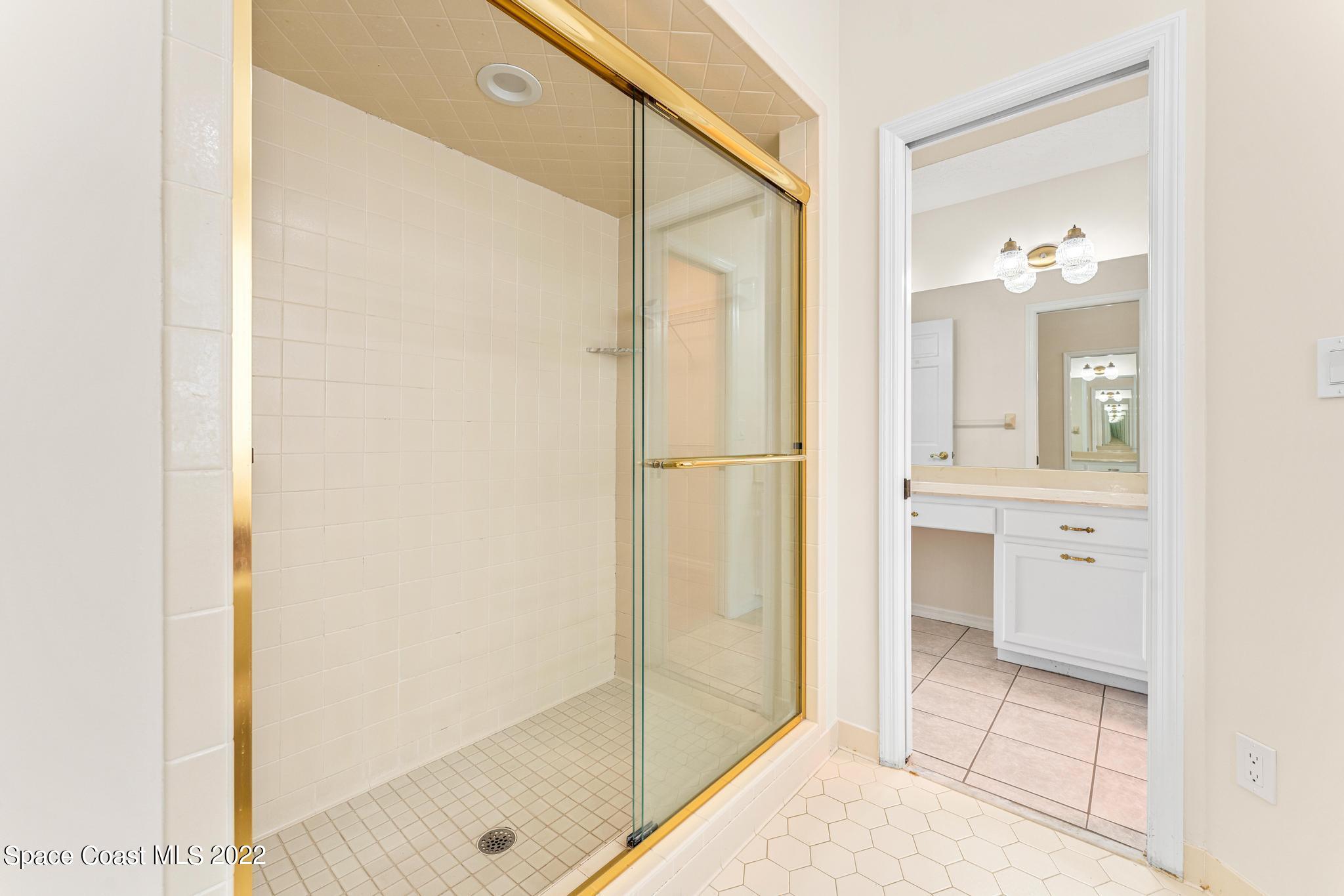 750 Kerry Downs Circle Melbourne, FL 32940 - Photo 15 of 34 a bathroom with a shower and a sink