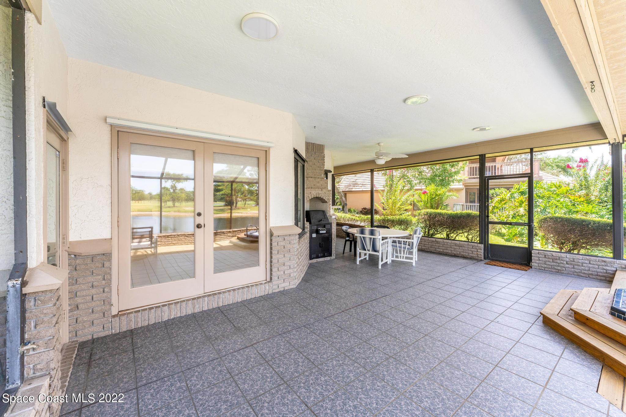750 Kerry Downs Circle Melbourne, FL 32940 - Photo 21 of 34 a view of an empty room with large windows