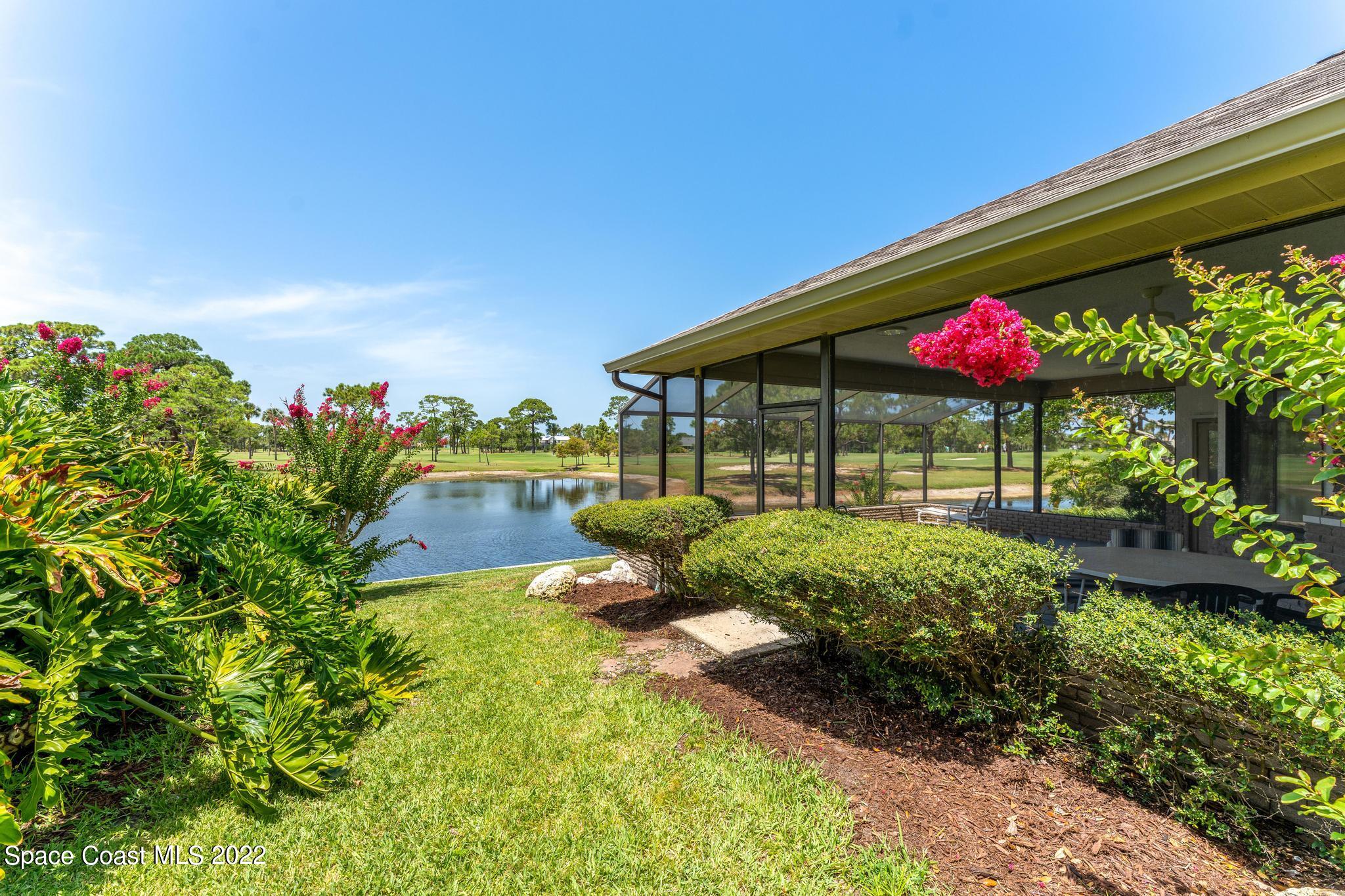 750 Kerry Downs Circle Melbourne, FL 32940 - Photo 24 of 34 a view of a house with yard and a garden