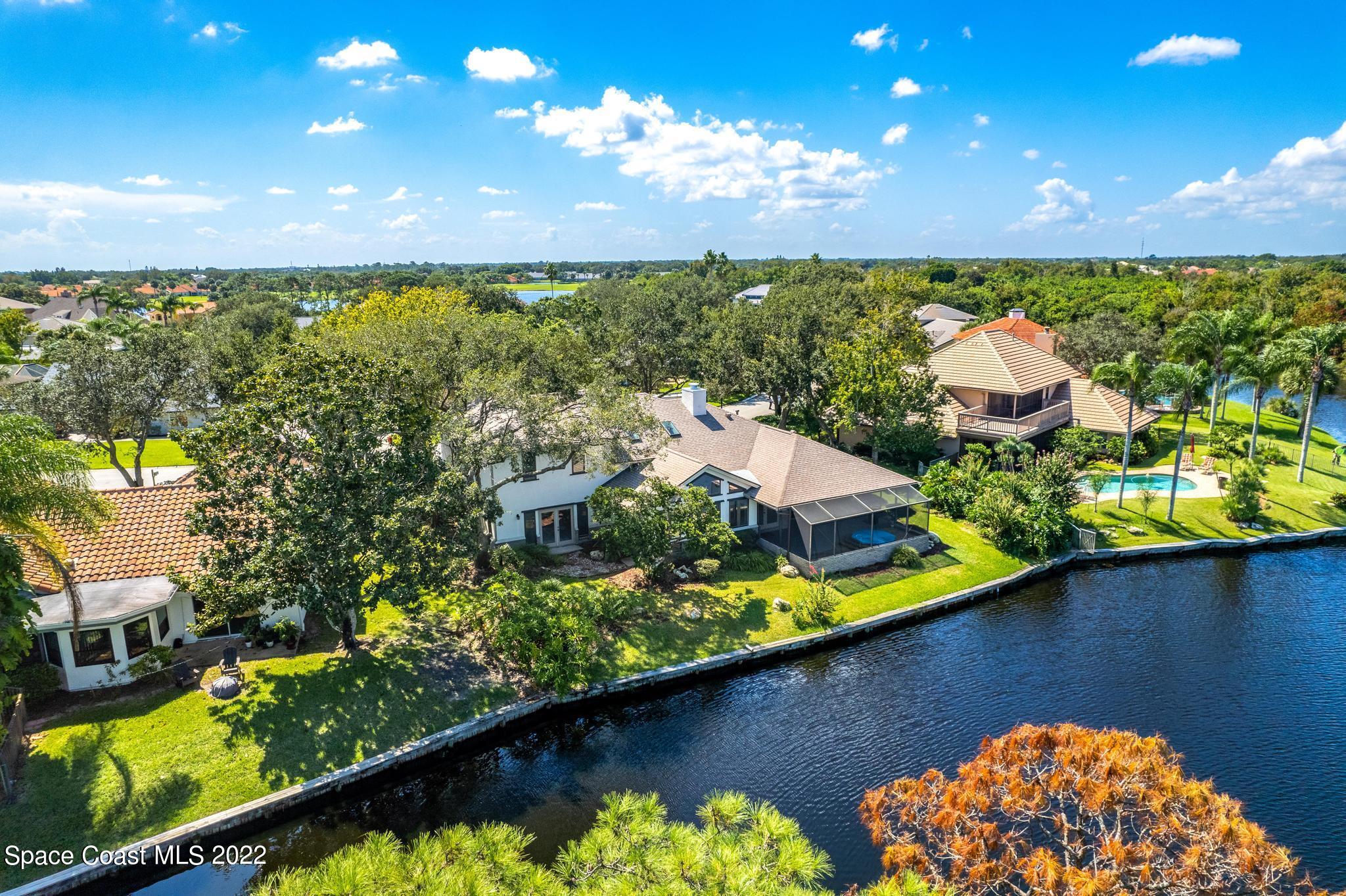 750 Kerry Downs Circle Melbourne, FL 32940 - Photo 27 of 34 an aerial view of a house with a lake view