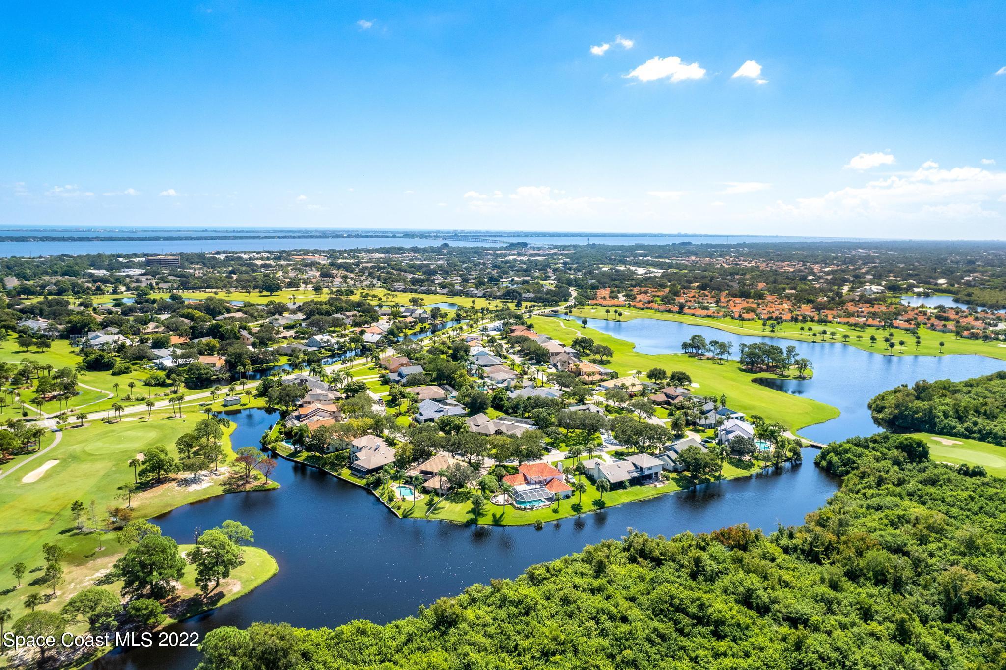 750 Kerry Downs Circle Melbourne, FL 32940 - Photo 29 of 34 an aerial view of residential houses with outdoor space and swimming pool