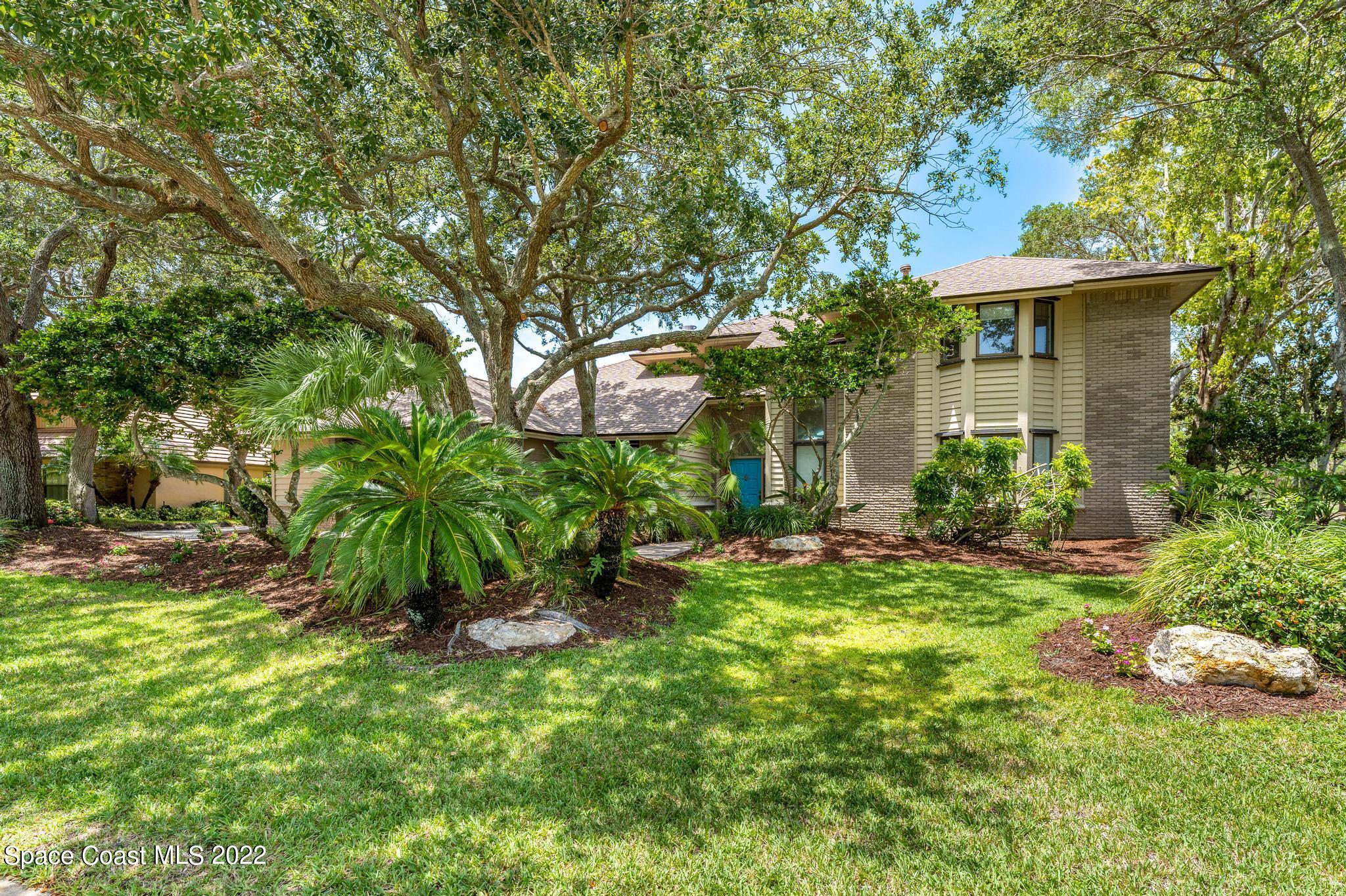 750 Kerry Downs Circle Melbourne, FL 32940 - Photo 33 of 34 a view of a house with a yard and sitting area