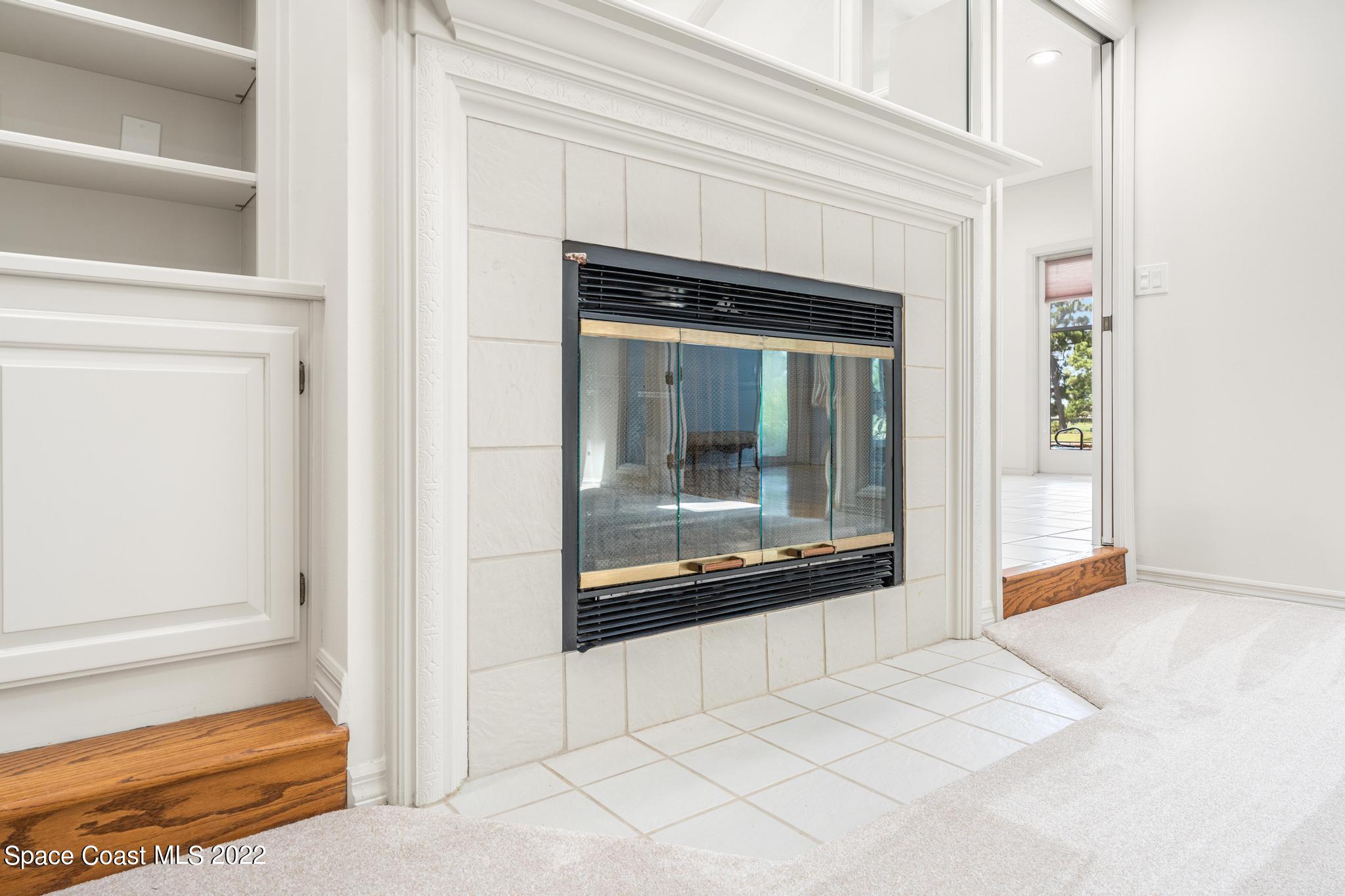 750 Kerry Downs Circle Melbourne, FL 32940 - Photo 4 of 34 a view of a livingroom with a fireplace