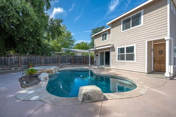 a bathroom with a granite countertop sink a toilet and a mirror