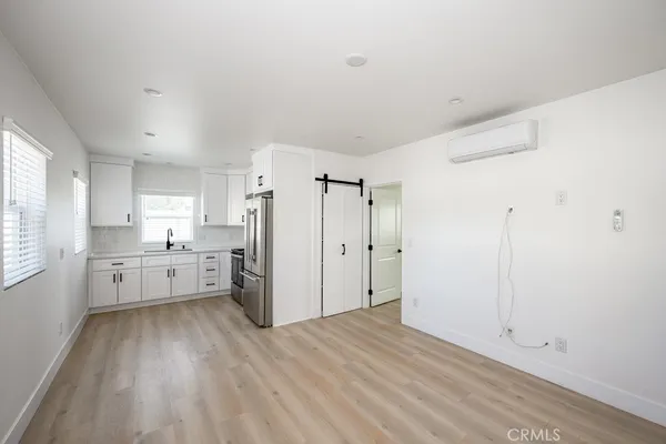 a view of a backyard with table and chairs and wooden fence