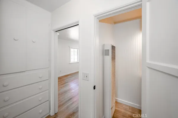 a view of hallway with wooden floor