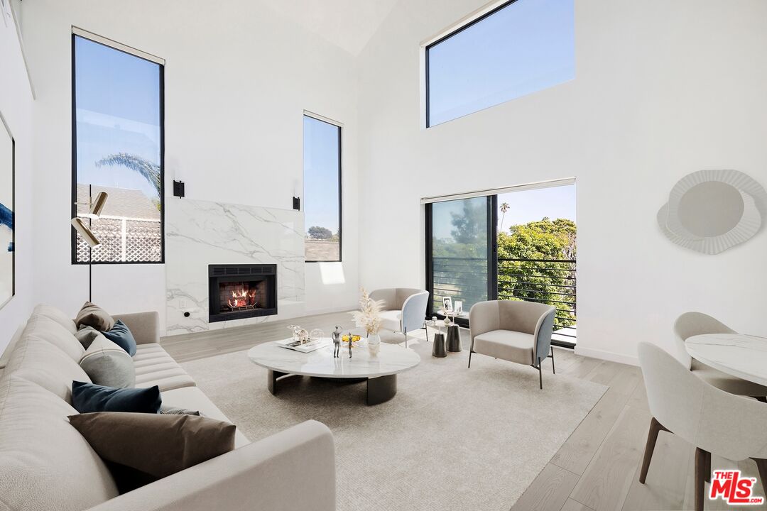 2225 4th Street, Unit B Santa Monica, CA 90405 - Photo 1 of 11 a living room with furniture and a fireplace