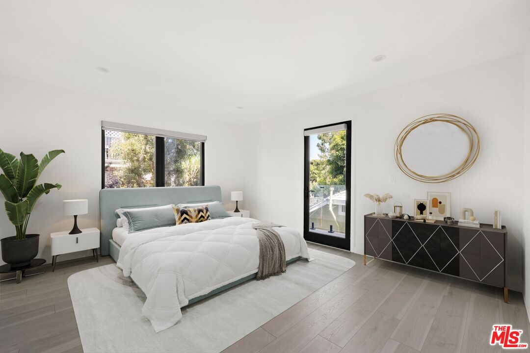 2225 4th Street, Unit B Santa Monica, CA 90405 - Photo 7 of 11 a bedroom with a bed a dresser and window