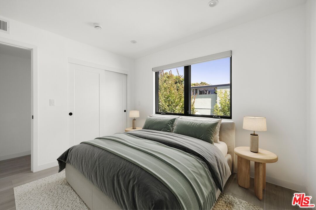 2225 4th Street, Unit B Santa Monica, CA 90405 - Photo 9 of 11 a bedroom with a bed and window