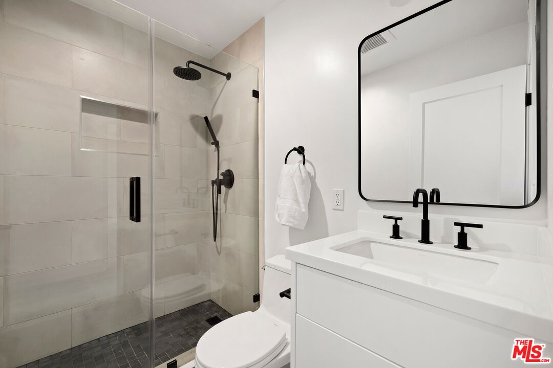 2225 4th Street, Unit B Santa Monica, CA 90405 - Photo 10 of 11 a bathroom with a sink toilet and shower