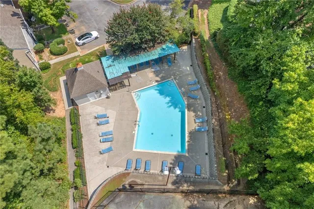 an aerial view of a house with outdoor space
