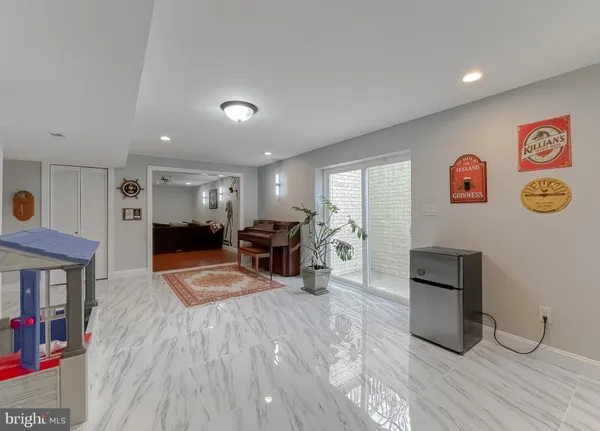 a view of a livingroom with furniture and a flat screen tv
