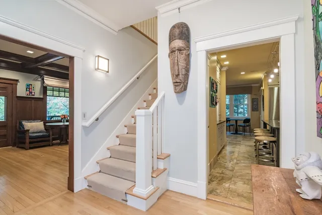 a view of a hallway with a livingroom and a bathroom