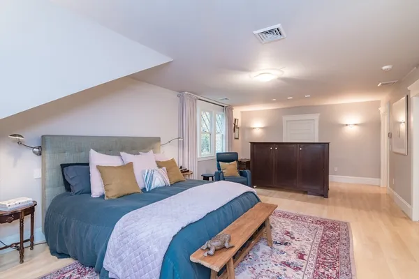 a bedroom with a bed and a couch