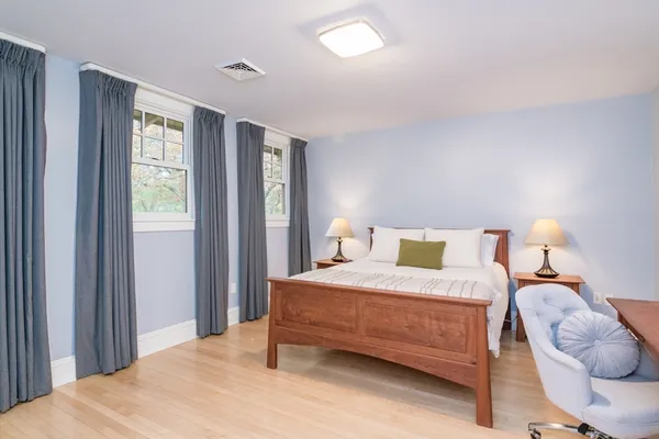 a bedroom with a bed and window