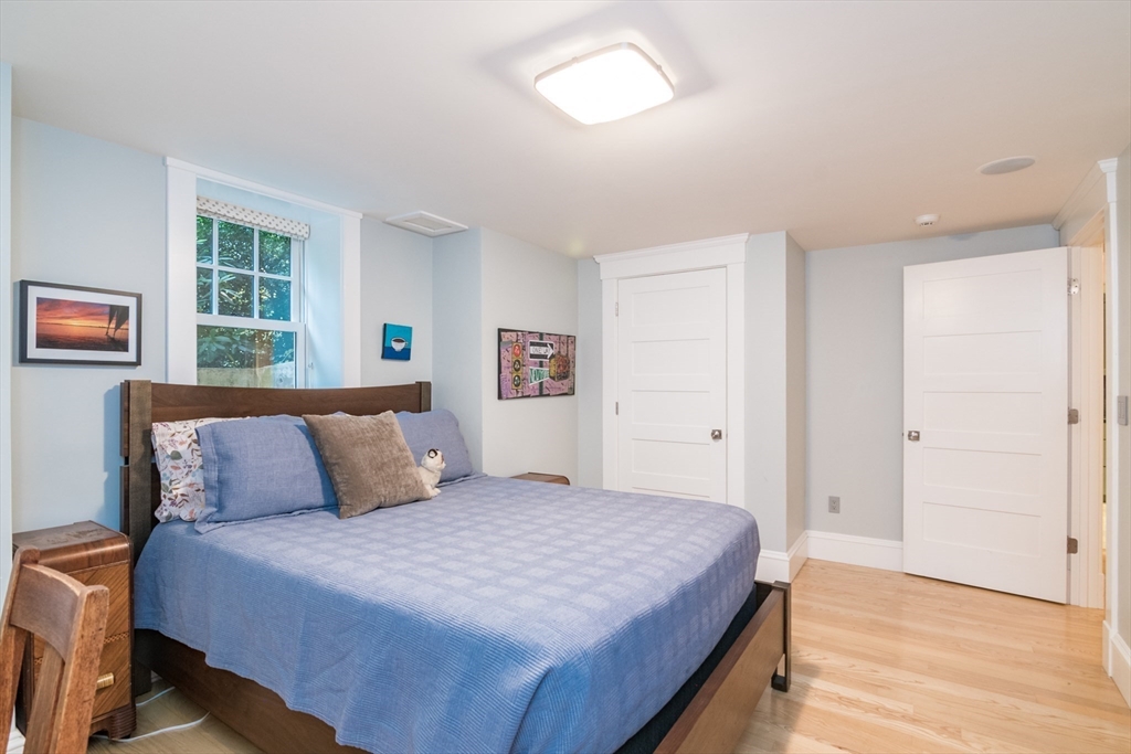 9 Harkness Road Pelham, MA 01002 - Photo 25 of 42 a bedroom with a bed and a window