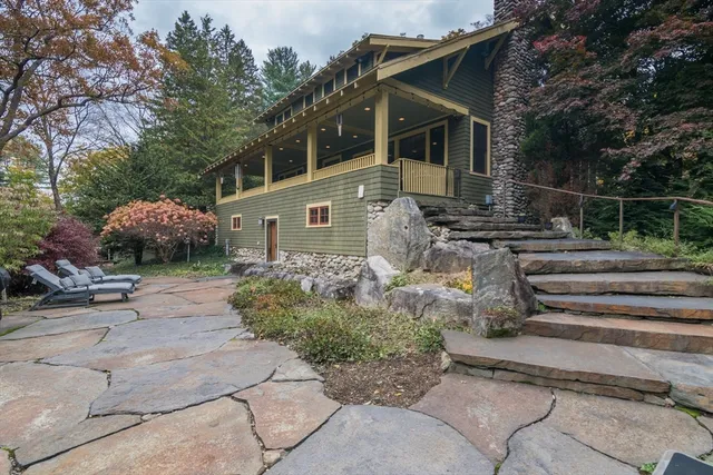 a aerial view of a house with a yard