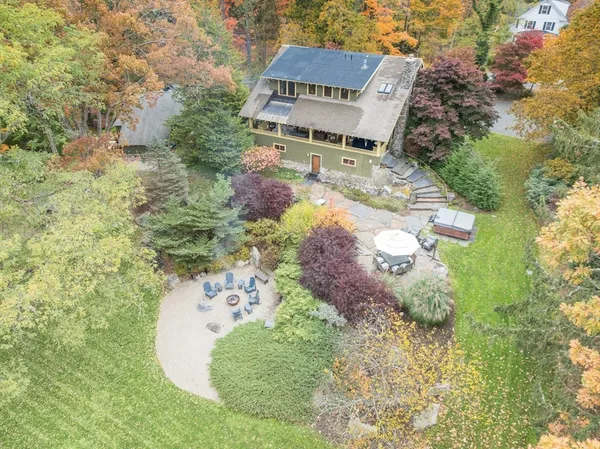 a aerial view of a house with a yard