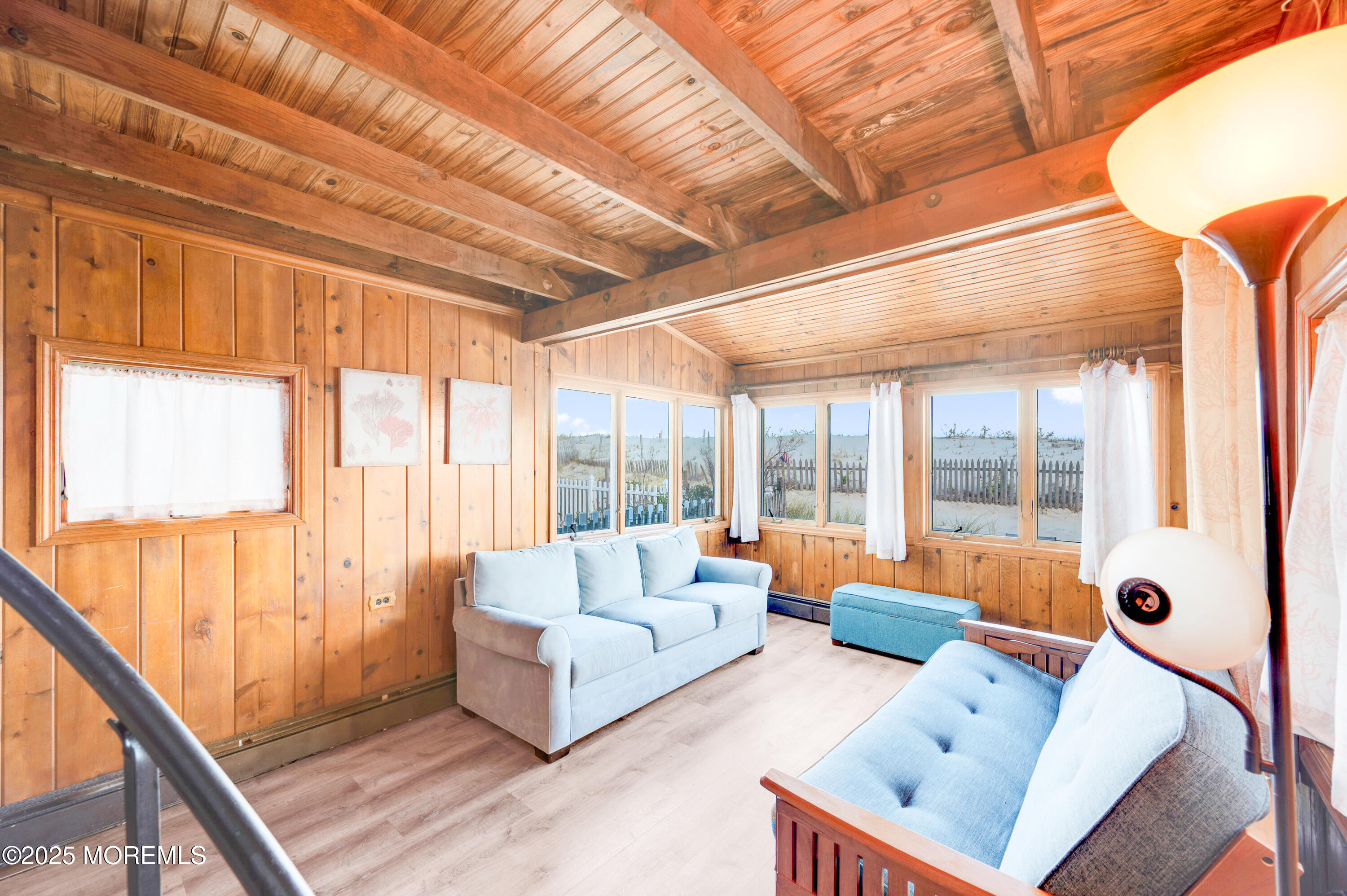 63 East Rutherford Lane Lavallette, NJ 08735 - Photo 13 of 33 a living room with furniture and floor to ceiling windows