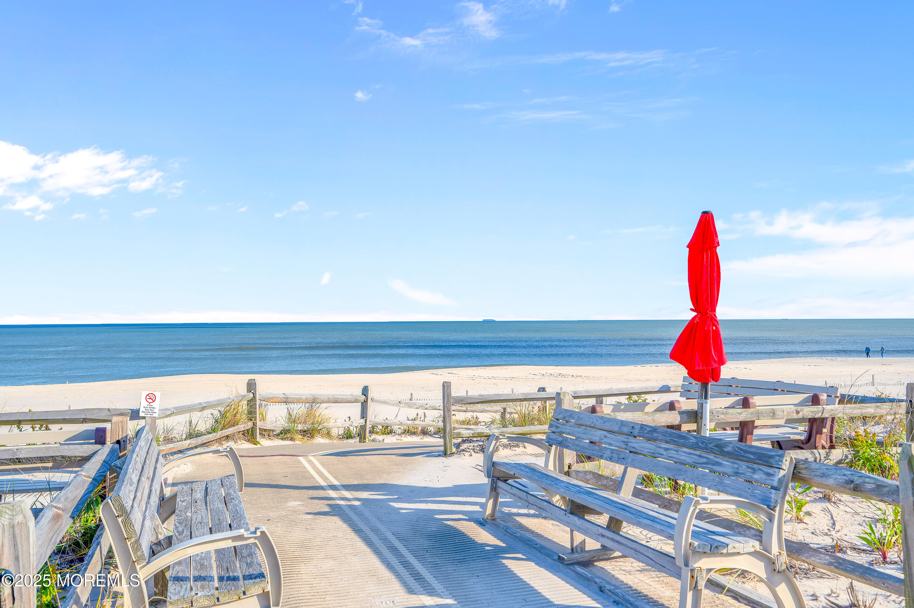 63 East Rutherford Lane Lavallette, NJ 08735 - Photo 28 of 33 a view of a swimming pool with a lounge chairs