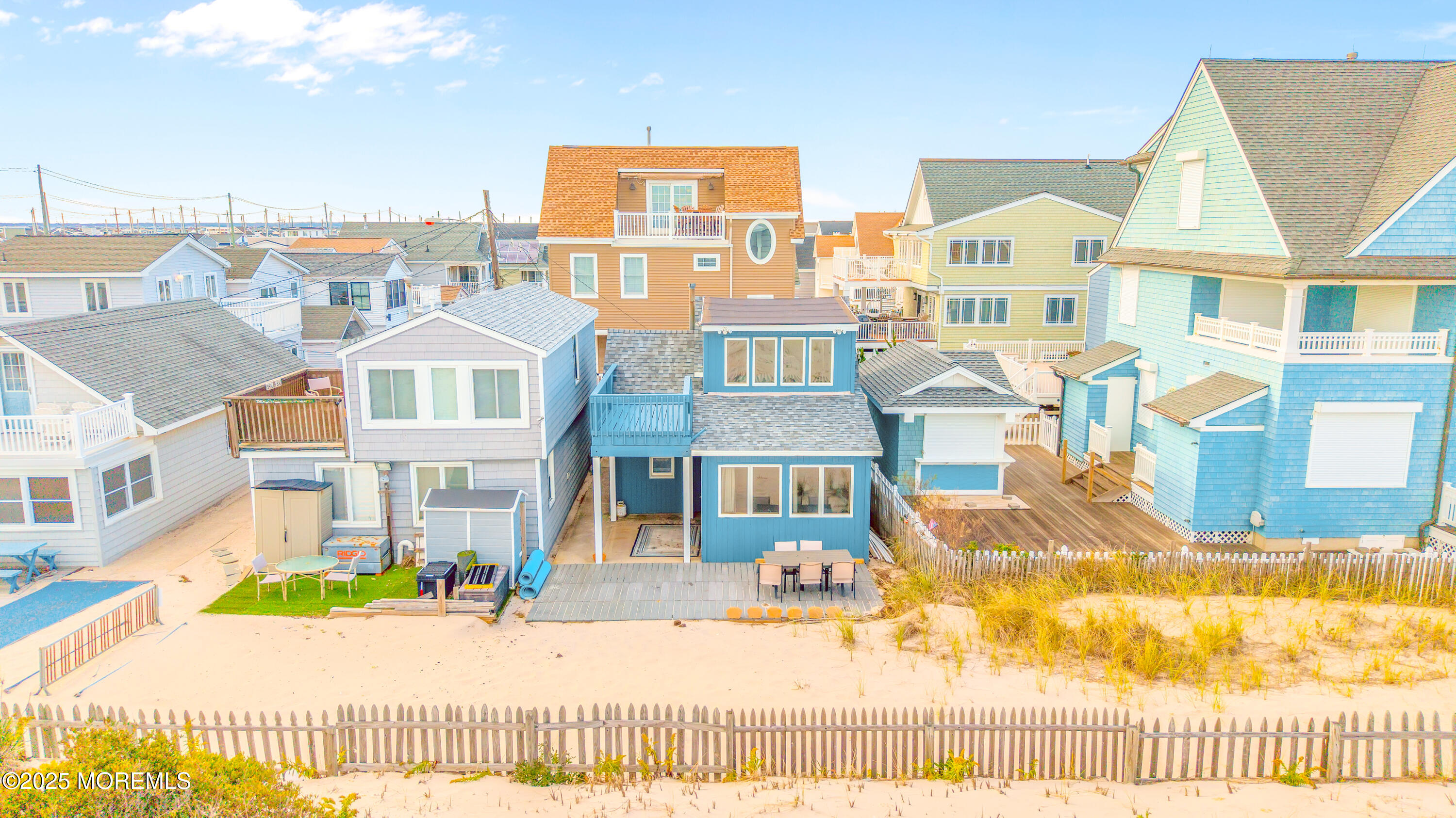 63 East Rutherford Lane Lavallette, NJ 08735 - Photo 4 of 33 a view of a brick house with many windows