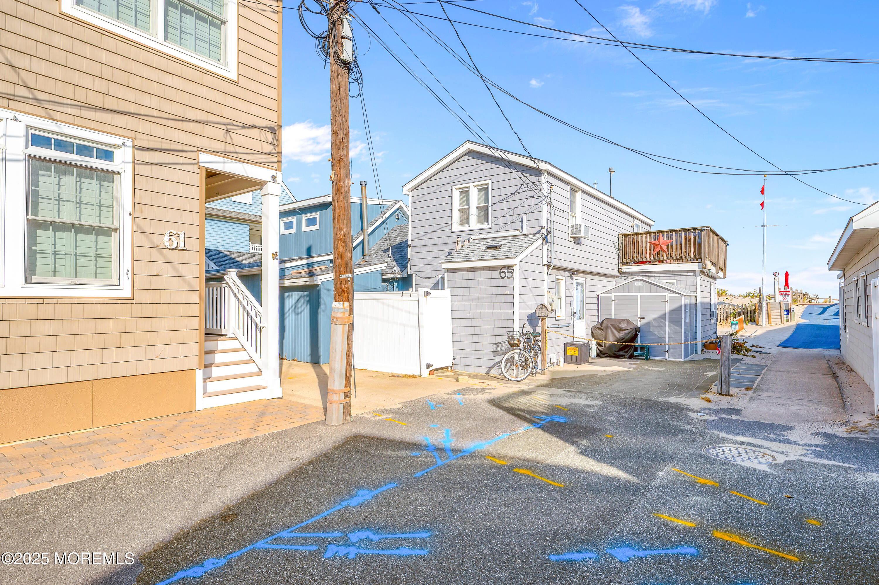 63 East Rutherford Lane Lavallette, NJ 08735 - Photo 7 of 33 a view of a building with a street