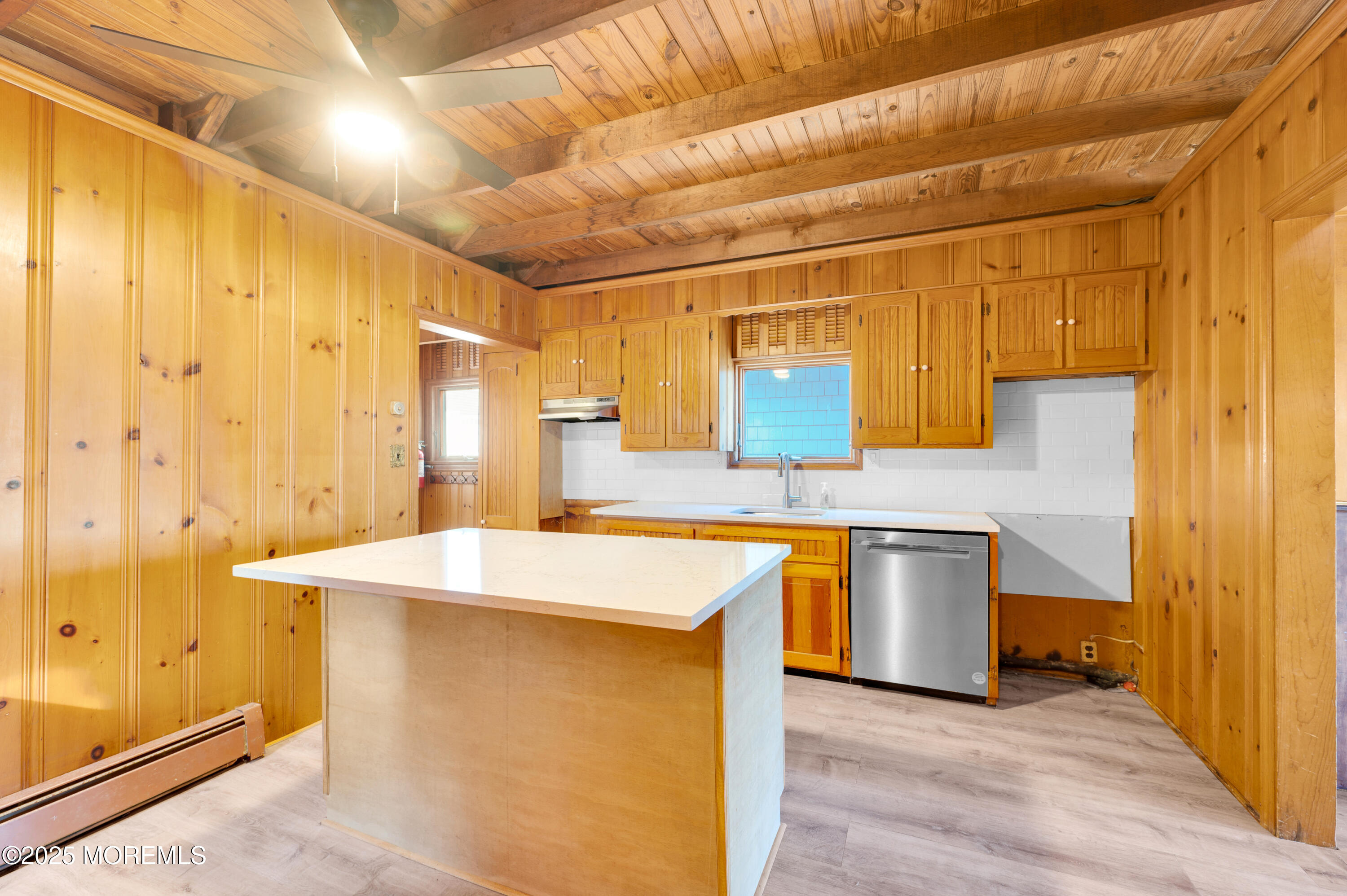 63 East Rutherford Lane Lavallette, NJ 08735 - Photo 10 of 33 a kitchen with stainless steel appliances granite countertop a sink a stove and a refrigerator