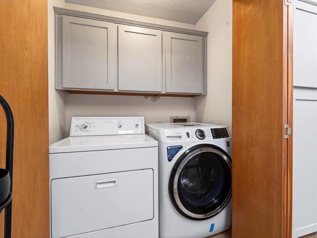 4345 Timberglen Road Dallas, TX 75287 - Photo 18 of 26 a utility room with dryer and washer