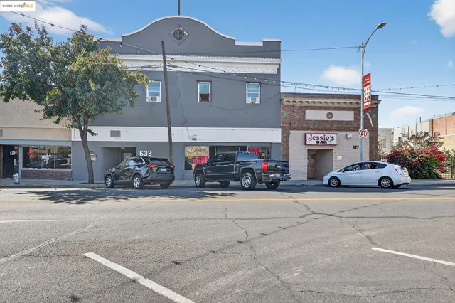 a view of a street with cars