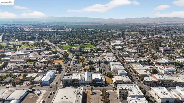 a front view of a city with a mountain